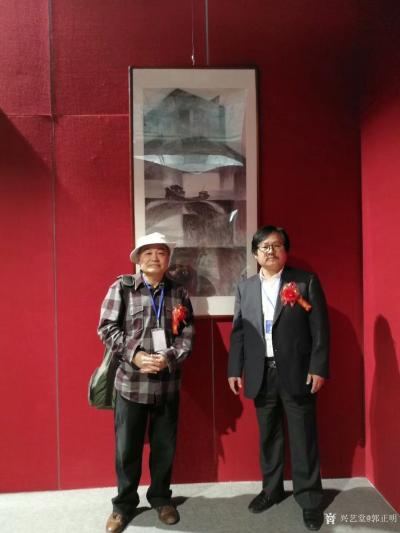 郭正明荣誉-2018.4.18曰郭正民在敦煌会展中心画展开幕中，图为与著名画家海军创作室主任【图5】