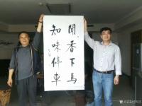 艺术家秦发艺收藏:闻香下马，知味停车。这幅对联，传说是乾隆为一饭馆所题。意思是【图0】