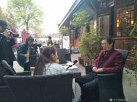 艺术家徐如茂生活:四川电视台,传媒大学毕生生在汉张桓候祠摄制纪录片《古城草根画【图0】